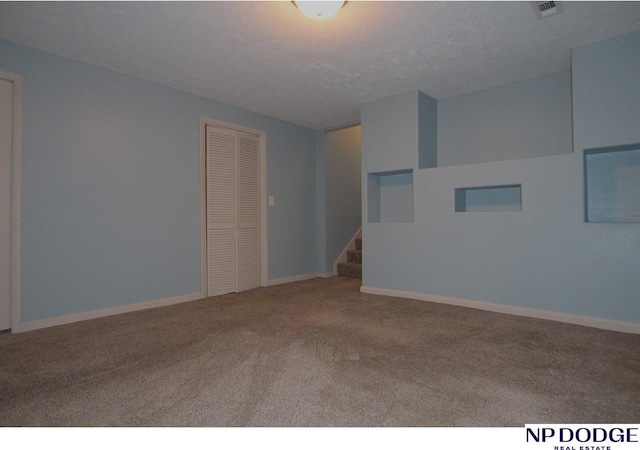 5807 S 136th St, Omaha, NE 68137 - carpeted empty room with baseboards and stairway