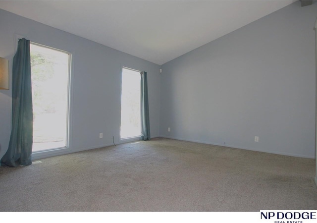 5807 S 136th St, Omaha, NE 68137 - spare room with carpet floors, plenty of natural light, lofted ceiling, and baseboards