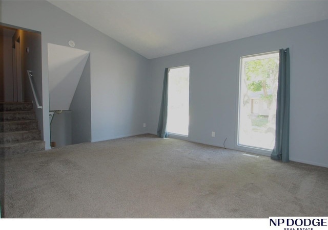 5807 S 136th St, Omaha, NE 68137 - carpeted spare room with lofted ceiling and stairway