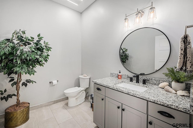 636 N 46th St, Omaha, NE 68132 - bathroom with vanity, toilet, baseboards, and tile patterned flooring