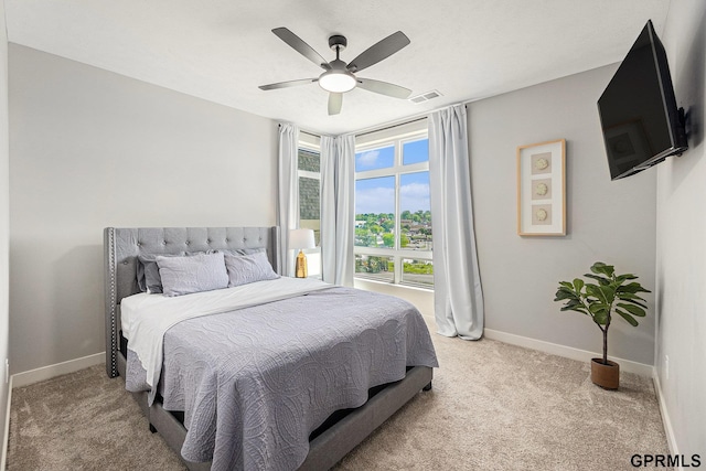 636 N 46th St, Omaha, NE 68132 - bedroom with light carpet, baseboards, and ceiling fan