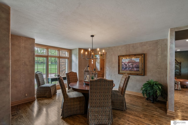 4725 S 184th Plz, Omaha, NE 68135 - dining space featuring wood finished floors, a chandelier, baseboards, and a textured ceiling