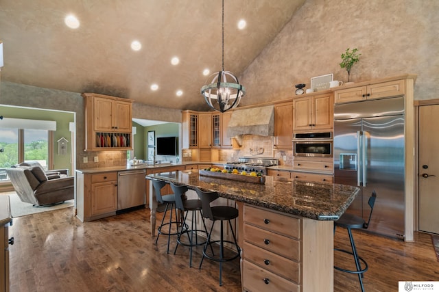 4725 S 184th Plz, Omaha, NE 68135 - kitchen featuring appliances with stainless steel finishes, custom range hood, a breakfast bar, dark wood-style floors, and recessed lighting