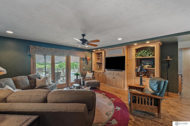 4725 S 184th Plz, Omaha, NE 68135 - living area with ceiling fan, light wood finished floors, recessed lighting, and a textured ceiling