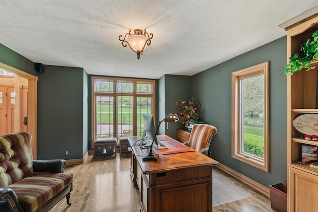 4725 S 184th Plz, Omaha, NE 68135 - home office with baseboards, healthy amount of natural light, and a textured ceiling