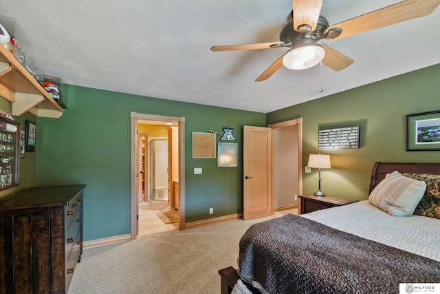 4725 S 184th Plz, Omaha, NE 68135 - bedroom with baseboards, light colored carpet, ensuite bath, and ceiling fan