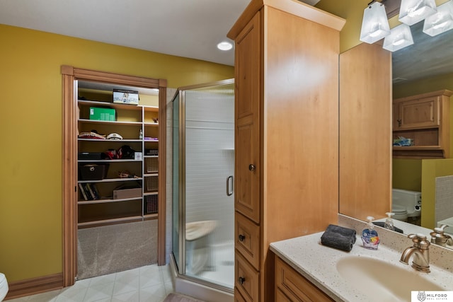 4725 S 184th Plz, Omaha, NE 68135 - full bath with toilet, a stall shower, vanity, and a walk in closet