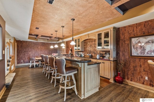 4725 S 184th Plz, Omaha, NE 68135 - indoor wet bar with dark wood-style floors, baseboards, tasteful backsplash, and decorative light fixtures