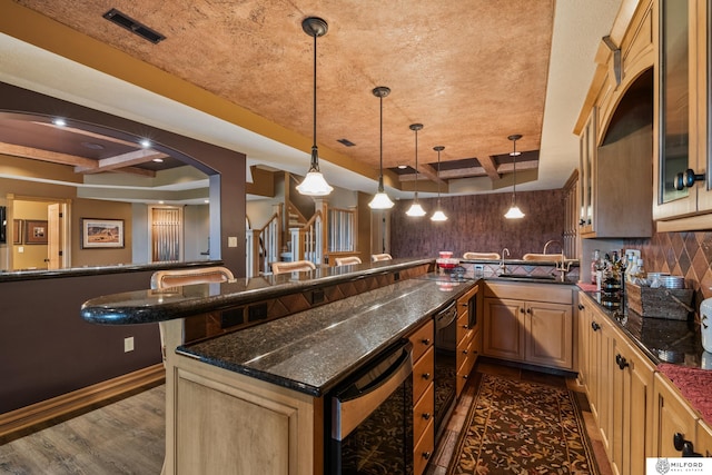 4725 S 184th Plz, Omaha, NE 68135 - kitchen featuring a sink, wine cooler, dark wood-style floors, hanging light fixtures, and a peninsula