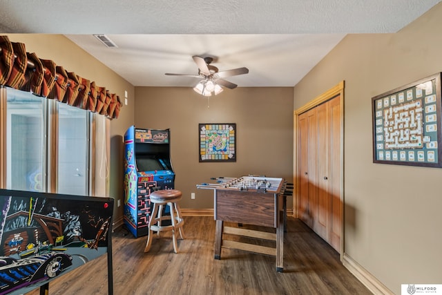 4725 S 184th Plz, Omaha, NE 68135 - recreation room with wood finished floors, ceiling fan, and baseboards