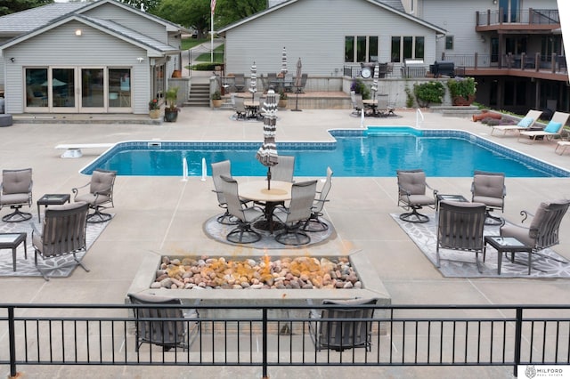 4725 S 184th Plz, Omaha, NE 68135 - outdoor pool with a patio area, an outbuilding, and a storage structure