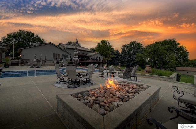4725 S 184th Plz, Omaha, NE 68135 - patio terrace at dusk with a fire pit and a patio area