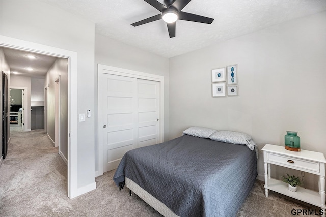 630 N 46th St, Omaha, NE 68132 - bedroom featuring carpet, a closet, baseboards, and a ceiling fan