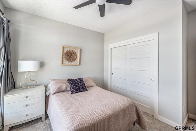 630 N 46th St, Omaha, NE 68132 - carpeted bedroom featuring a closet, baseboards, a ceiling fan, and a textured ceiling