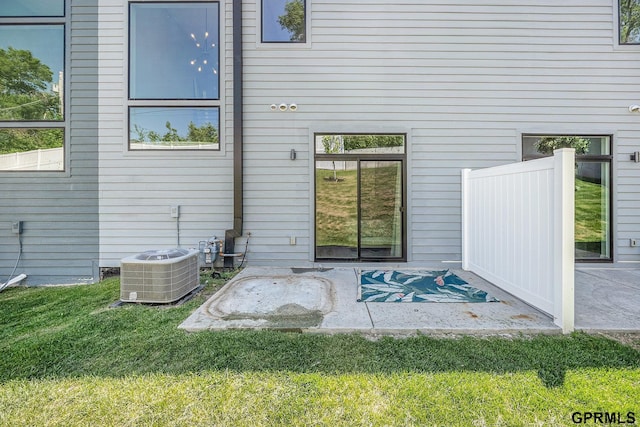 630 N 46th St, Omaha, NE 68132 - back of property featuring cooling unit, a yard, and a patio area