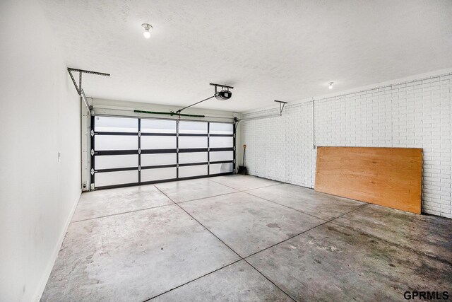 630 N 46th St, Omaha, NE 68132 - garage with a garage door opener and baseboards