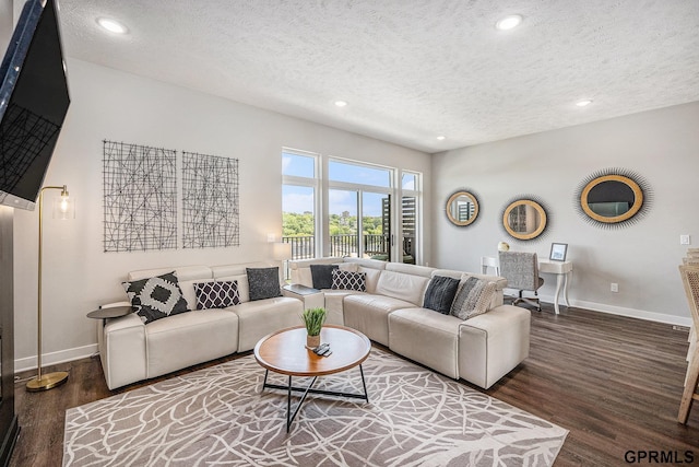 630 N 46th St, Omaha, NE 68132 - living room featuring wood finished floors, a textured ceiling, baseboards, recessed lighting, and a water view