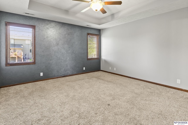 19677 Lamont St, Omaha, NE 68130 - carpeted empty room with ceiling fan, baseboards, and a raised ceiling