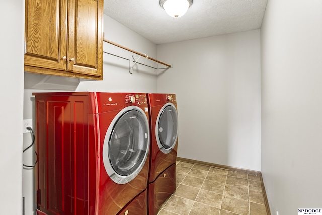 19677 Lamont St, Omaha, NE 68130 - laundry area with washer and clothes dryer, cabinet space, and baseboards