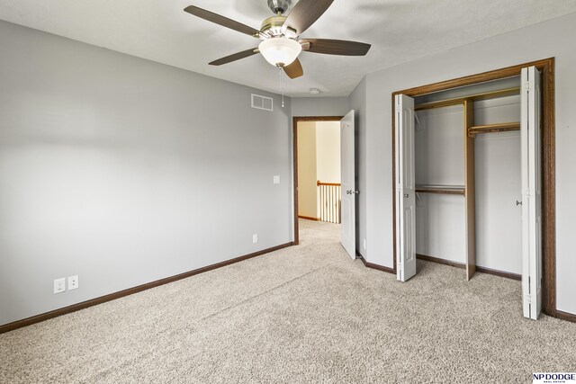 19677 Lamont St, Omaha, NE 68130 - unfurnished bedroom with light carpet, baseboards, a closet, and ceiling fan
