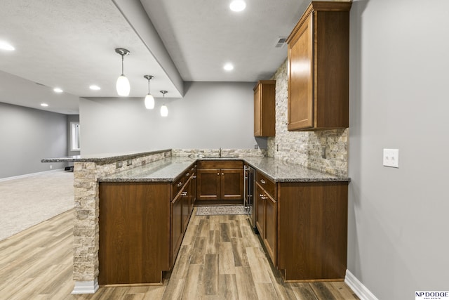 19677 Lamont St, Omaha, NE 68130 - bar area featuring a sink, light wood-type flooring, baseboards, decorative backsplash, and recessed lighting
