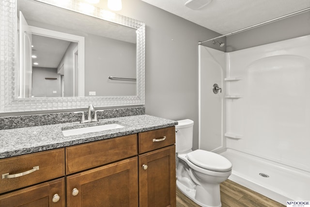 19677 Lamont St, Omaha, NE 68130 - full bath with wood finished floors, toilet, vanity, and a shower