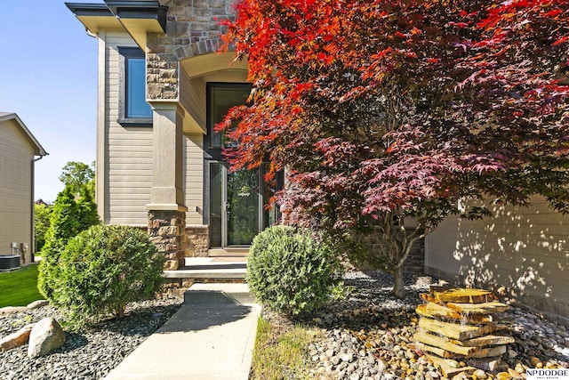 19677 Lamont St, Omaha, NE 68130 - doorway to property featuring stone siding