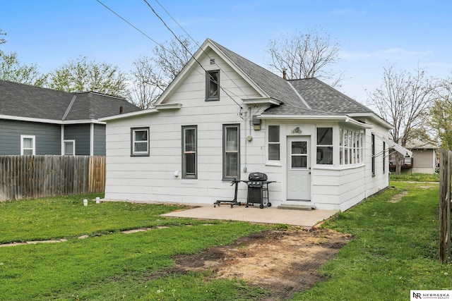 6633 Platte Ave, Lincoln, NE 68507 - back of house featuring roof with shingles and a patio