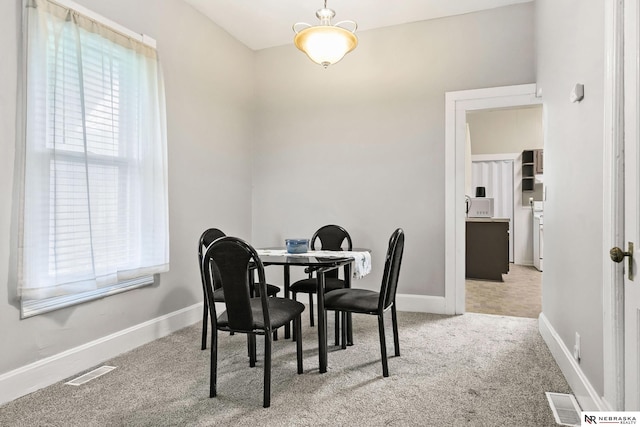 6633 Platte Ave, Lincoln, NE 68507 - dining area featuring carpet floors, healthy amount of natural light, baseboards, and a desk