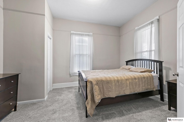 6633 Platte Ave, Lincoln, NE 68507 - bedroom featuring multiple windows, carpet floors, and baseboards