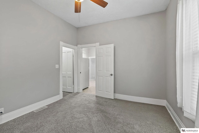 6633 Platte Ave, Lincoln, NE 68507 - unfurnished bedroom with carpet flooring, baseboards, and a ceiling fan