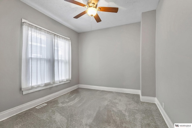 6633 Platte Ave, Lincoln, NE 68507 - carpeted empty room with baseboards and ceiling fan