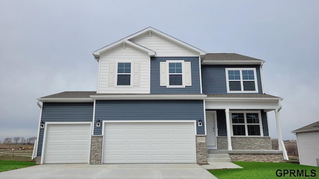 8514 S 184th Ave, Gretna, NE 68136 - craftsman-style home with stone siding, driveway, a garage, and roof with shingles