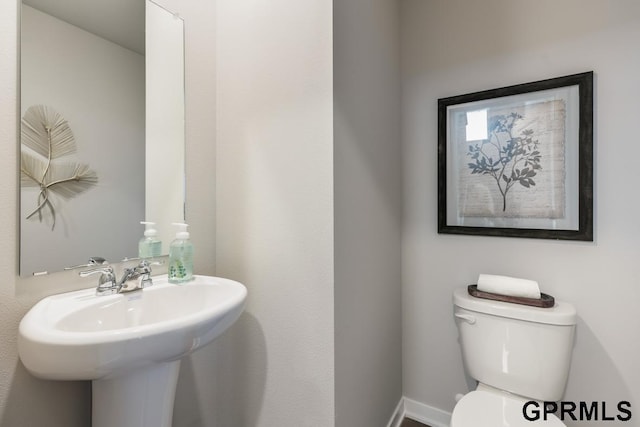 8514 S 184th Ave, Gretna, NE 68136 - half bath featuring toilet, a sink, and baseboards