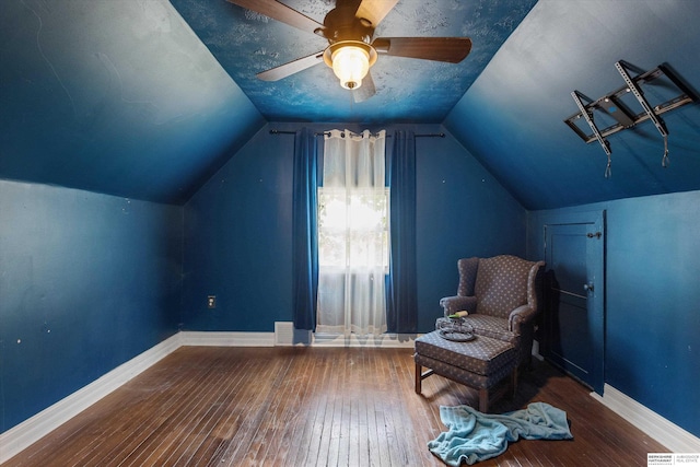 712 Bancroft St, Omaha, NE 68108 - living area featuring hardwood / wood-style flooring, baseboards, vaulted ceiling, and ceiling fan