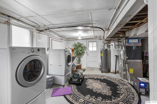 712 Bancroft St, Omaha, NE 68108 - laundry room with washer and dryer, water heater, and heating unit