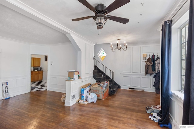 712 Bancroft St, Omaha, NE 68108 - entrance foyer featuring a decorative wall, a ceiling fan, stairway, wood finished floors, and ornamental molding