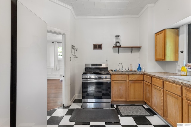 712 Bancroft St, Omaha, NE 68108 - kitchen with stainless steel gas range, a sink, ornamental molding, tile patterned floors, and open shelves