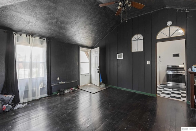 712 Bancroft St, Omaha, NE 68108 - entryway with vaulted ceiling, a ceiling fan, hardwood / wood-style flooring, baseboards, and wooden walls