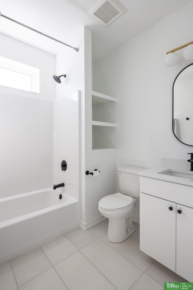 5301 Elmwood Plz, Omaha, NE 68106 - bathroom featuring vanity, toilet, shower / bathtub combination, and tile patterned flooring