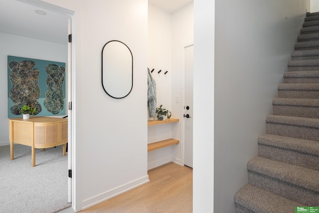 5301 Elmwood Plz, Omaha, NE 68106 - staircase with wood finished floors and baseboards