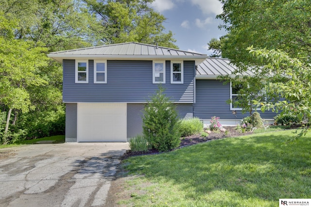 2000 Murray Rd, Plattsmouth, NE 68048 - view of front of home with a standing seam roof, concrete driveway, a front yard, a garage, and metal roof