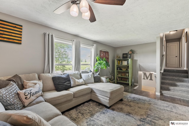 2000 Murray Rd, Plattsmouth, NE 68048 - living room with wood finished floors, a textured ceiling, a ceiling fan, stairs, and baseboards