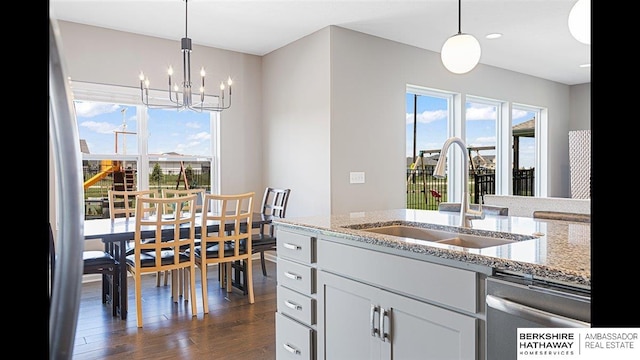 20904 Camden Ave, Omaha, NE 68022 - kitchen featuring a sink, dark wood-type flooring, dishwasher, a chandelier, and white cabinets