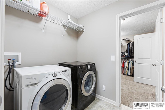 20904 Camden Ave, Omaha, NE 68022 - laundry area featuring washing machine and clothes dryer, a textured ceiling, baseboards, and light colored carpet