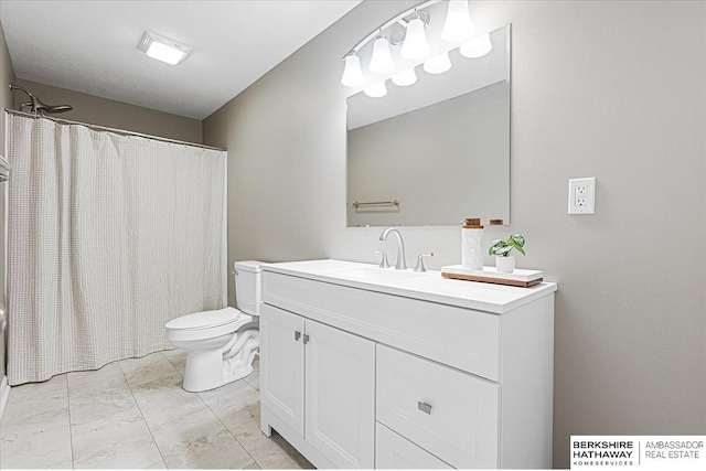 20904 Camden Ave, Omaha, NE 68022 - bathroom featuring toilet, vanity, and marble look tiles