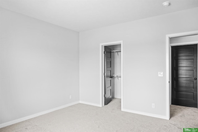 5508 N 212th St, Elkhorn, NE 68022 - unfurnished bedroom with carpet, baseboards, a spacious closet, and a closet
