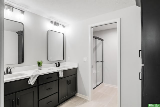 5508 N 212th St, Elkhorn, NE 68022 - full bath with a stall shower, double vanity, and baseboards