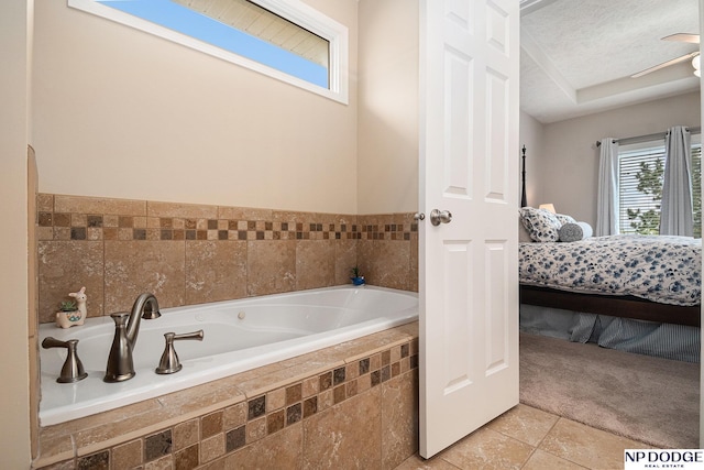 7409 N 160th St, Bennington, NE 68007 - ensuite bathroom featuring a bath, tile patterned flooring, and a textured ceiling