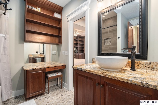 7409 N 160th St, Bennington, NE 68007 - full bathroom featuring vanity, baseboards, and a shower with curtain